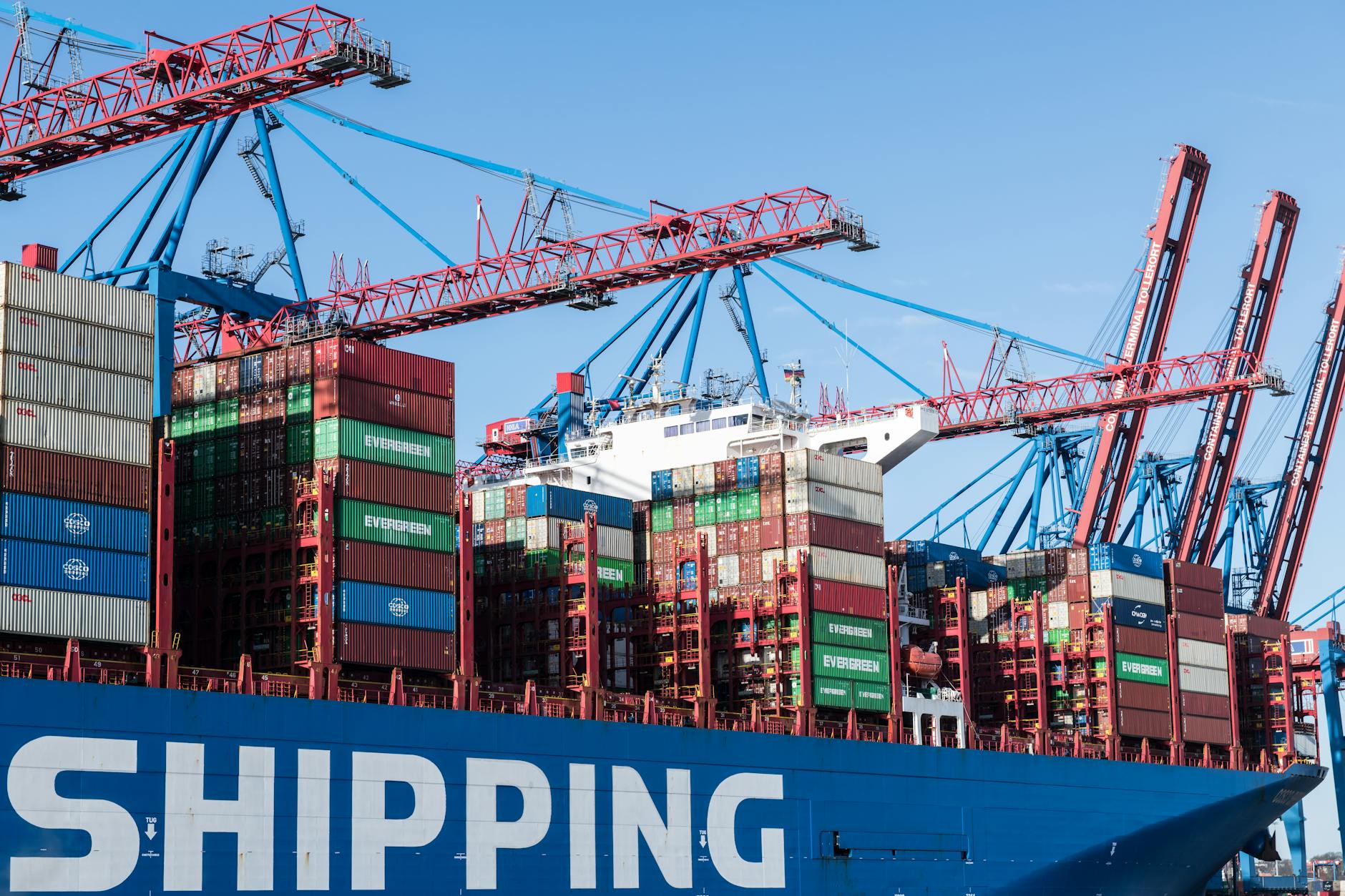 containers and cranes at hamburg port